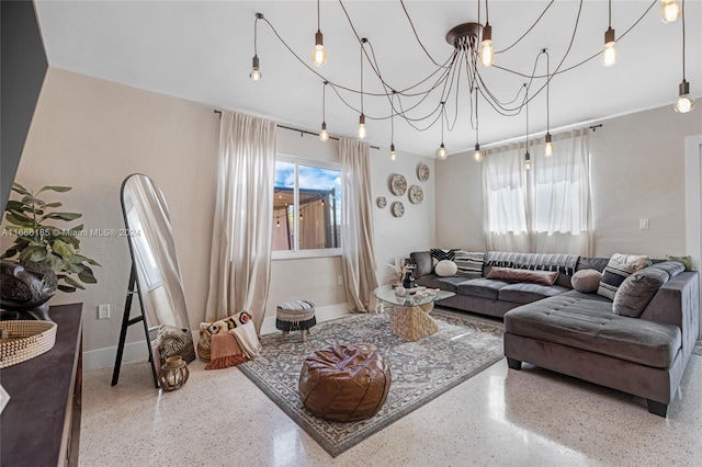 living room with an inviting chandelier and plenty of natural light