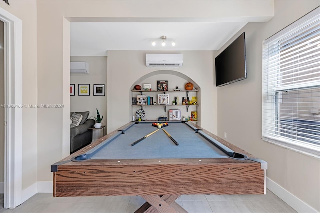 game room with light tile patterned floors, billiards, and a wall mounted air conditioner