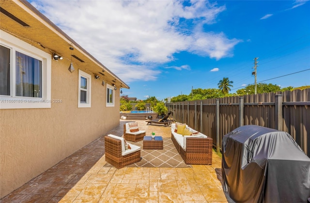 view of patio / terrace featuring outdoor lounge area and grilling area