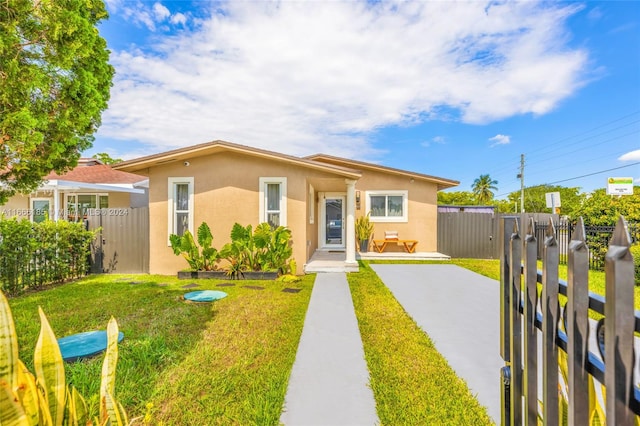 view of front of home with a front yard