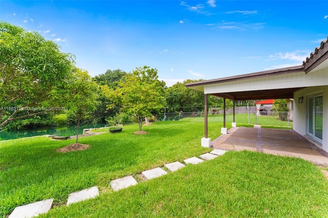 view of yard with a fenced backyard and a patio