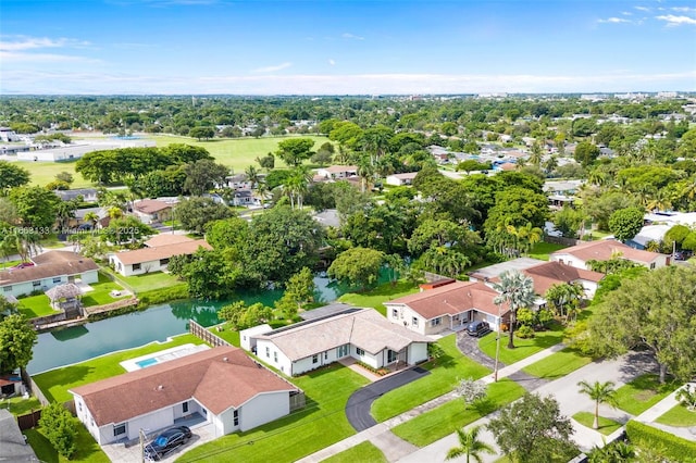 birds eye view of property featuring a water view and a residential view