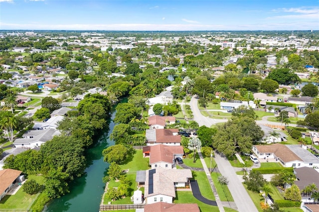 birds eye view of property with a residential view and a water view