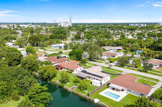 birds eye view of property featuring a water view and a residential view