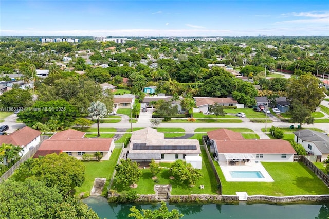 bird's eye view with a residential view and a water view