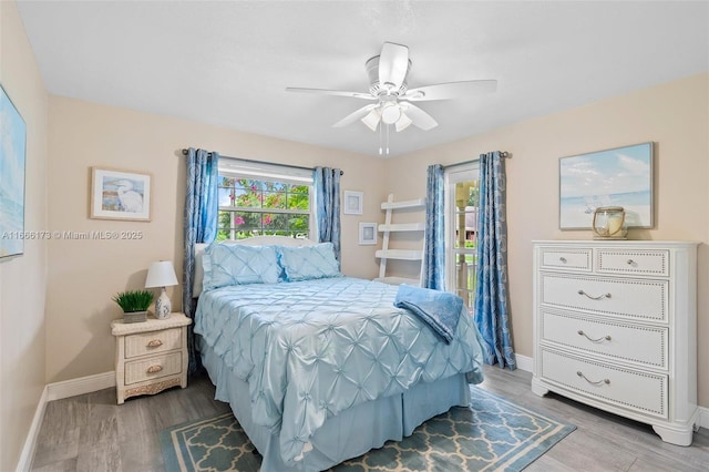 bedroom featuring ceiling fan and wood-type flooring