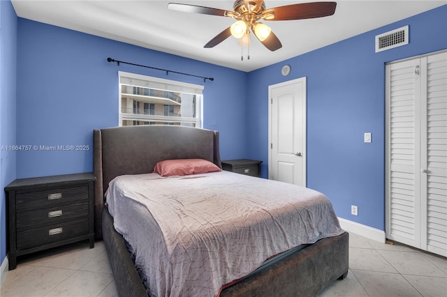 bedroom with ceiling fan and light tile patterned floors