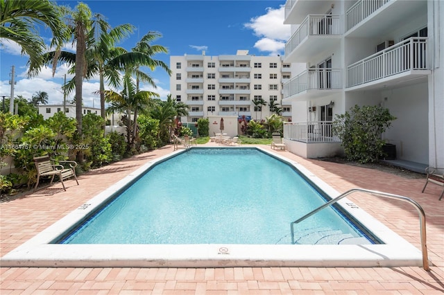 view of swimming pool with a patio