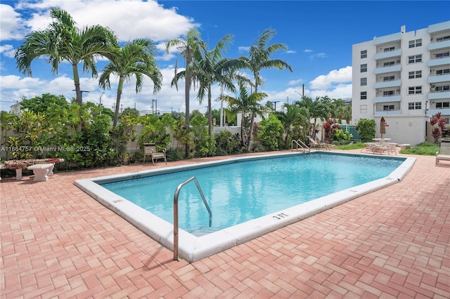 view of swimming pool with a patio area