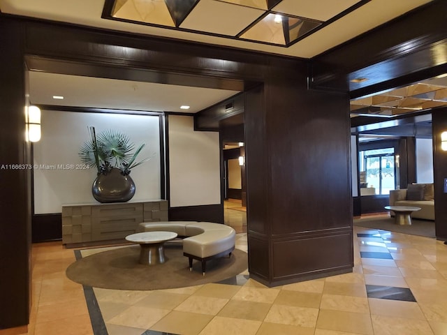 hallway featuring light tile patterned floors and a mail area