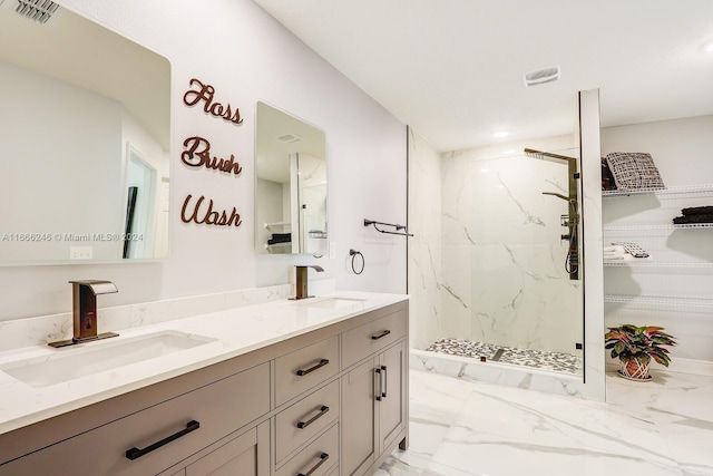 bathroom with vanity and a shower with shower door