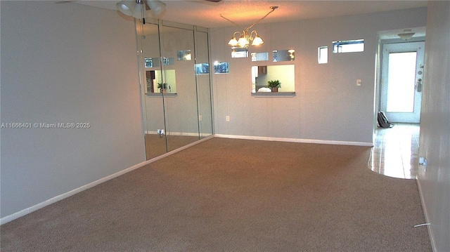 1800 SW 81st Ave Unit 1403, North Lauderdale, FL 33068 - carpeted empty room featuring baseboards, a chandelier, and ceiling fan