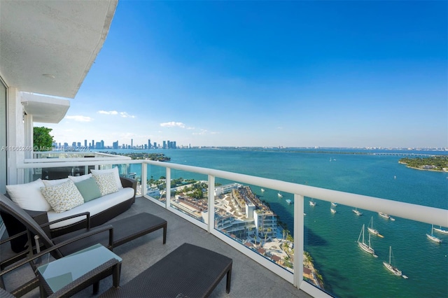 balcony featuring a water view