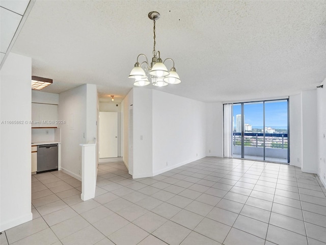 unfurnished room featuring floor to ceiling windows, a chandelier, a textured ceiling, and light tile patterned flooring