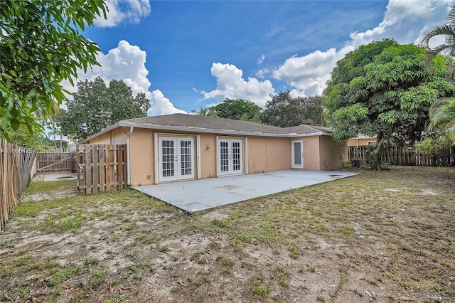 rear view of house featuring french doors and a patio