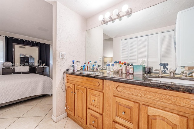 bathroom with vanity and tile patterned floors