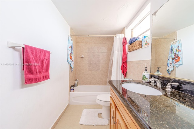 full bathroom with tile patterned floors, shower / bathtub combination with curtain, vanity, and toilet