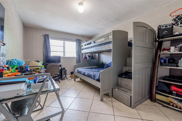 tiled bedroom featuring a textured ceiling and ornamental molding