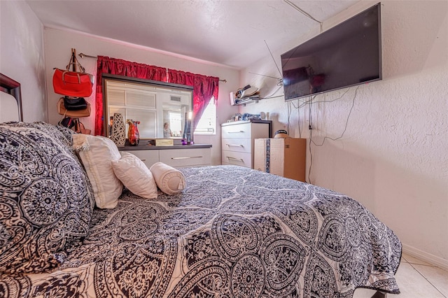 bedroom featuring light tile patterned floors