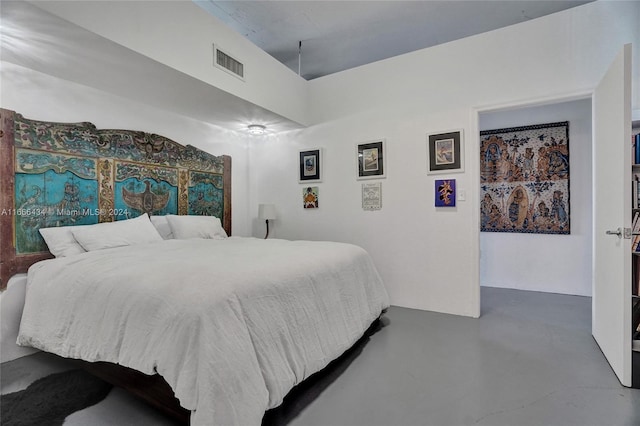 bedroom with concrete floors