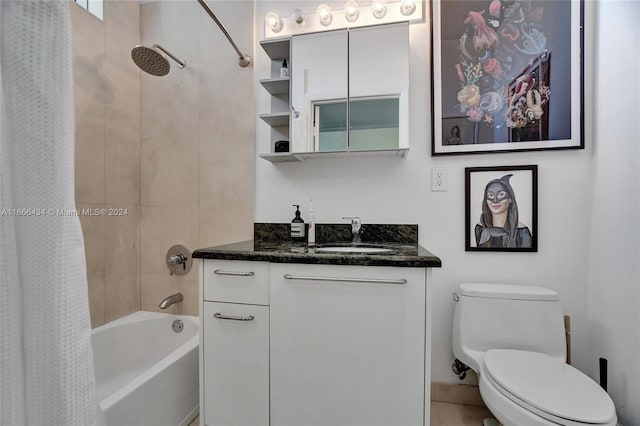 full bathroom with vanity, shower / bath combo with shower curtain, and toilet