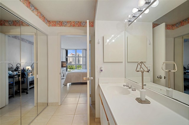 bathroom featuring tile patterned flooring and vanity