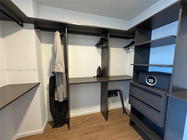 spacious closet featuring hardwood / wood-style floors