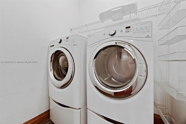 laundry area with independent washer and dryer