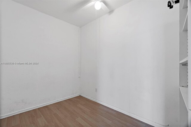 unfurnished room with ceiling fan and hardwood / wood-style floors