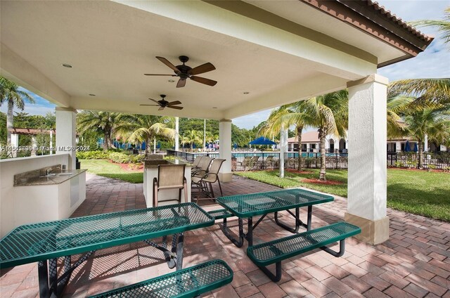 view of patio featuring ceiling fan