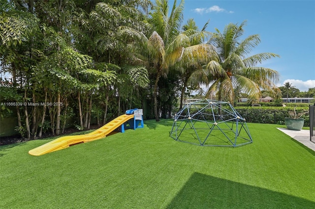 view of playground featuring a lawn