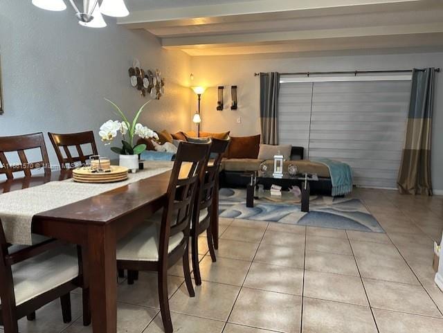 tiled dining space featuring a notable chandelier and beam ceiling