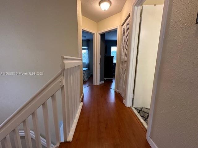 corridor featuring dark wood-type flooring