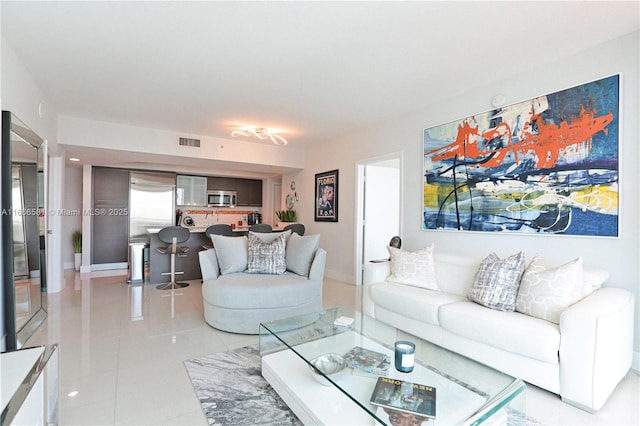 living room with tile patterned floors