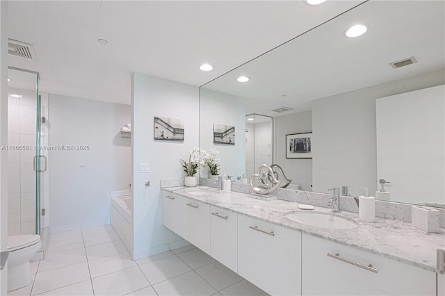 full bathroom featuring tile patterned floors, toilet, separate shower and tub, and vanity