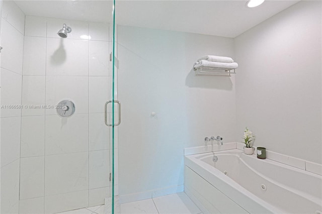 bathroom with plus walk in shower and tile patterned flooring