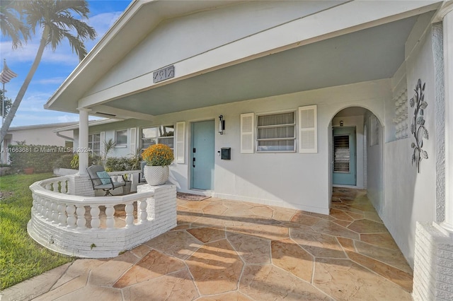 entrance to property featuring a patio area