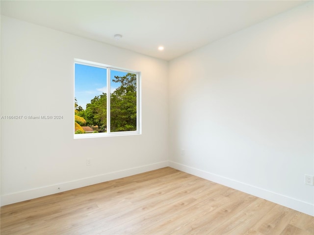 spare room featuring light wood-type flooring