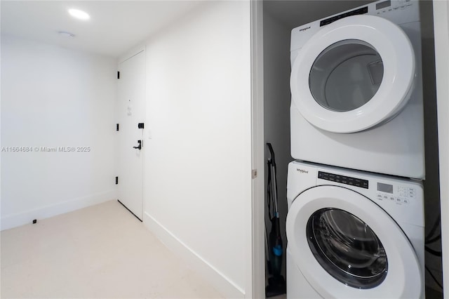 laundry area featuring stacked washer and clothes dryer