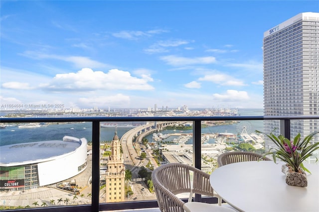 balcony featuring a water view