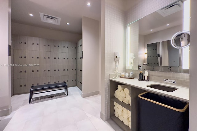 bathroom with tile patterned floors and vanity