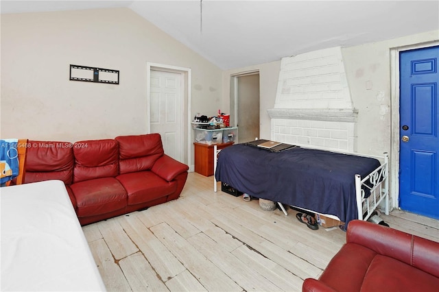 bedroom featuring vaulted ceiling and hardwood / wood-style flooring