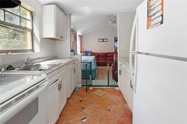 kitchen featuring sink, vaulted ceiling, white cabinetry, white appliances, and ceiling fan