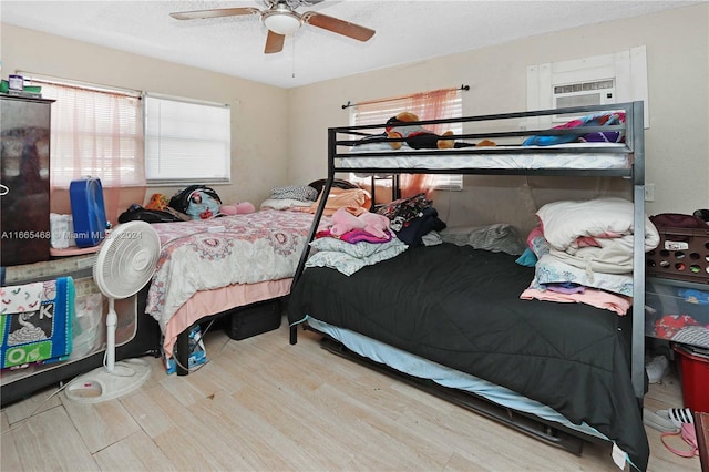 bedroom featuring ceiling fan and hardwood / wood-style flooring