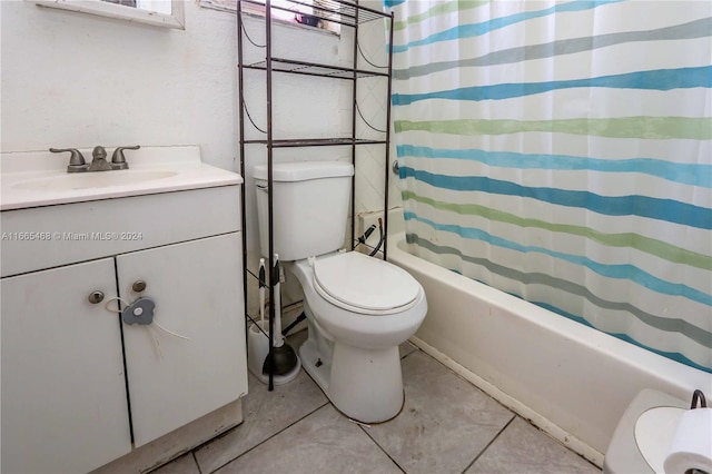 full bathroom featuring shower / bath combo, vanity, toilet, and tile patterned floors