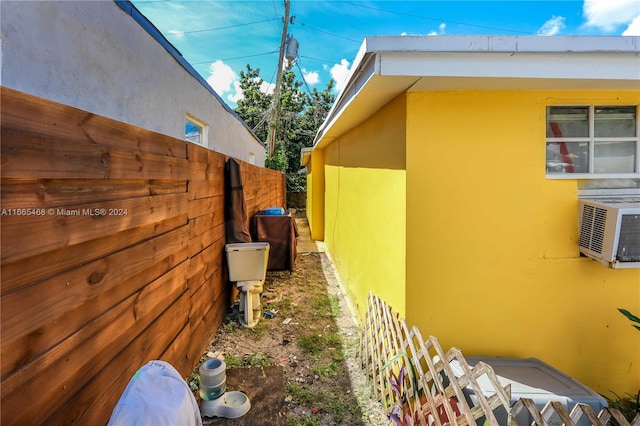 view of side of property with cooling unit