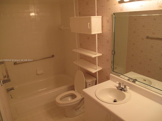 full bathroom with tile patterned flooring, washtub / shower combination, vanity, and toilet