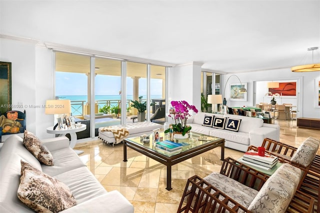 tiled living room featuring a water view and ornamental molding