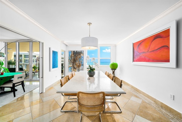 dining area with crown molding and a wealth of natural light