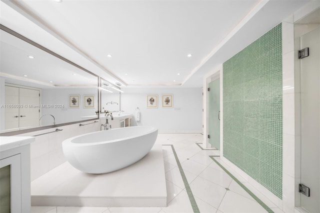 bathroom featuring vanity, shower with separate bathtub, and tile patterned flooring